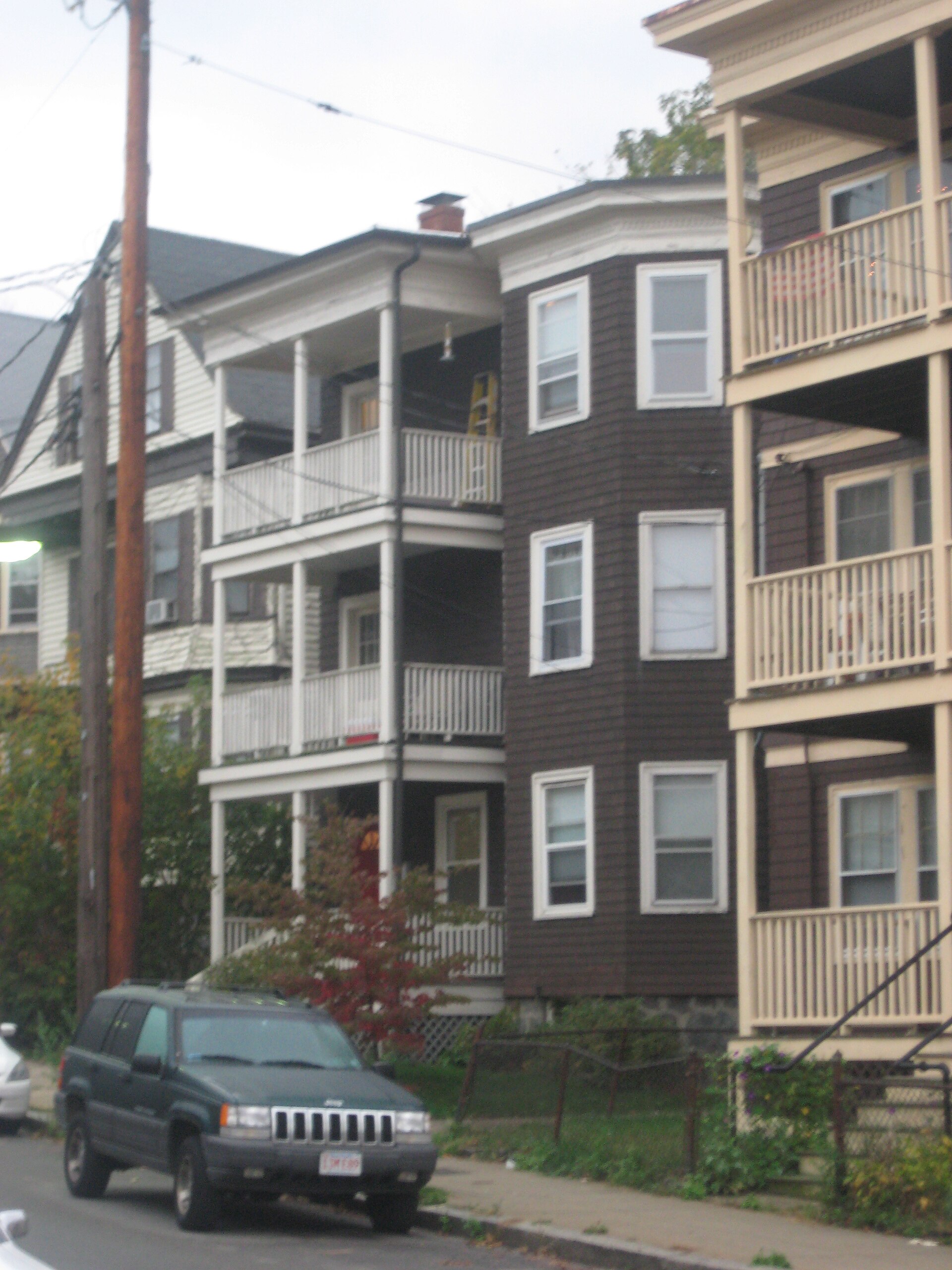 A row of three-storey wooden triple-decker houses near Forest Hills, Boston